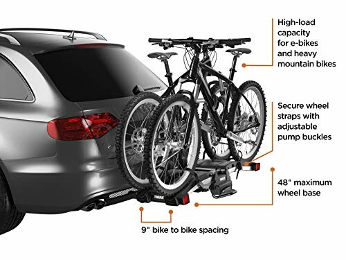 Car with a bike rack holding two bicycles, featuring secure wheel straps and high-load capacity.