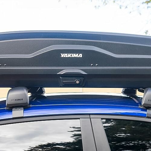 Car with Yakima rooftop cargo box mounted on roof