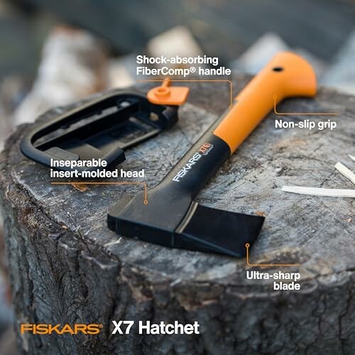 Fiskars X7 Hatchet on a tree stump with features labeled.