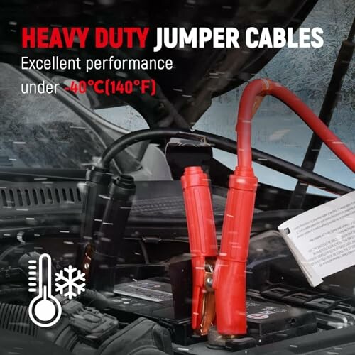 Heavy duty jumper cables in use under cold conditions.