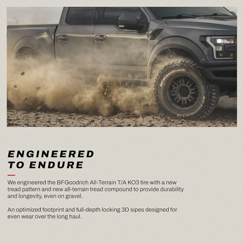 Truck with BFGoodrich All-Terrain tire on gravel.